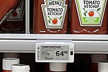 Many grocery stores provide unit price information for all products. In this Norwegian grocery store, the price for a bottle of ketchup is displayed in terms of the price paid per package (64.90 kr) as well as the paid paid per kilogram (111.90 kr). This allows customers to see how much they will pay and to quickly compare products that have different sizes of packages. SPAR varehandel hyller (Supermarket GROCERY store aisle shelves) Heinz ketchup NORWAY 2023-08-31 (cropped).jpg