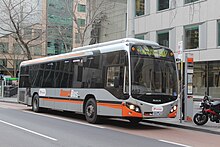 SmartBus liveried Custom Coaches bodied MAN 18.310 on Lonsdale Street in August 2013 SmartBus (Transdev) number 682 (7972AO) MAN on route 907 in Lonsdale St, 2013.JPG