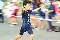 A happy moment at the TFR 2014 in Ho Chi Minh City, Vietnam (2014) Smiling boy at TFR 2014.jpg