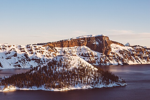 Image: Snow covered mountains at Crater Lake (Unsplash)