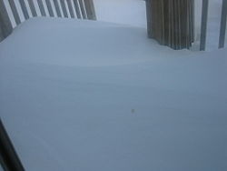 Snowdrifts covering deck outside a front door in Southern Ontario. Snowpile door deck.jpg