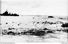 Survivors from Prince of Wales and Repulse in the water as a destroyer moves in for the rescue. Survivors in water.jpg