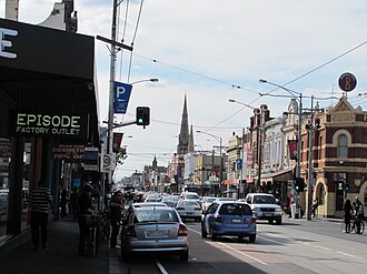 Brunswick, Victoria, where novel is set. Sydney Rd 03 N Brunswick near Brunswick Hotel with traffic.jpg