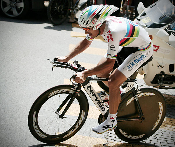 Fabian Cancellara riding a time-trial Cervelo bicycle with aerodynamic wheels and aero bars.