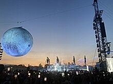 Photo of the stage for the European leg of the tour, consisting of a large inflatable moon and a Hajime Sorayama statue in the middle of the stage. The Weeknd - Live at Ippodromo SNAI La Maura, Milan (July 27, 2023).jpg