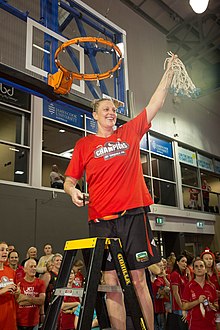 Townsville Fire captain Suzy Batkovic cutting down the game net following the club's WNBL Grand Final victory at Townsville RSL Stadium, 18 March 2016 Townsville Fire captain Suzy Batkovic, Townsville RSL Stadium, 18 March 2016.jpg