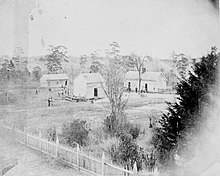 Original campus buildings on the Miller plantation, 1882 Tuskegee Institute in 1882.jpg