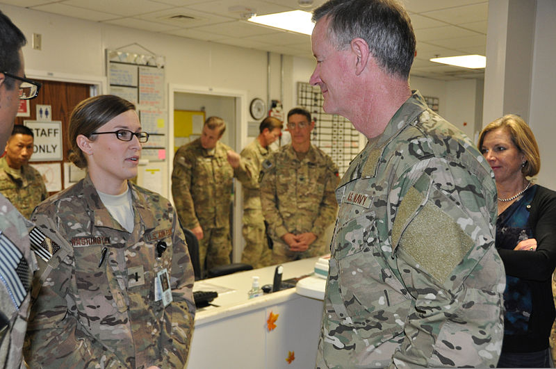 File:U.S. Navy Adm. William H. McRaven, second from right, the commander of U.S. Special Operations Command, and his wife, Georgeann McRaven, right, listen to an Air Force hospital staff member at the Heathe N. Craig 131128-F-UR349-004.jpg