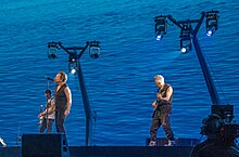 The lighting system used four articulating "lampposts" behind the stage. U2 performing at Sphere in Las Vegas on Feb 7 2024 by Frank Weigel (79).jpg