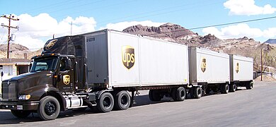 UPS International 9000 towing triple trailers in Beatty, Nevada.