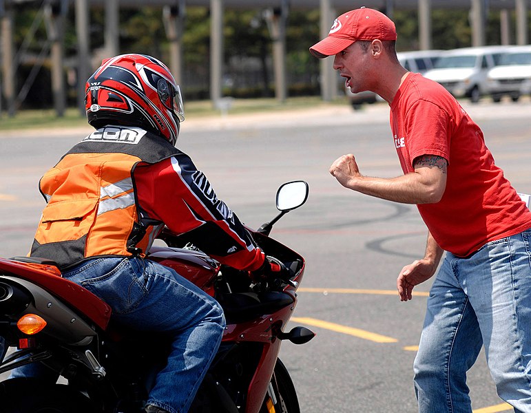 File:US Navy 080611-N-5345W-104 Volunteer motorcycle safety instructor Nick Brunney gives feedback to Aviation Boatswain's Mate (Handling) 2nd Class Jun DeLeon, after performing a rapid deceleration maneuvering exercise.jpg