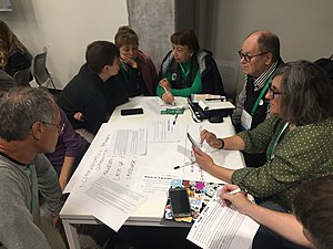 Farkhad interpreting into Tatar for Bashkir Wiki-grandma's delegates: Saria (left, red hair) and Zaytuna (right, green sleeves).