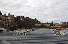 Waverley Station roof and Waverley Bridge. The two ramps lead from the bridge into the station. Waverley Station Roof (4530231733).jpg