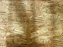 Type of Phoenician ships called hippos (name given by the Greeks, because of its mascaron shaped like a horse's head) carrying wood, depicted in an Assyrian relief from Sargon's palace at Khorsabad. Woodtrade.jpg