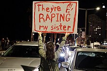 Israeli protestor holding sign alluding to sexual assault of hostages in front of US Embassy in Tel Aviv in March 2024 106729 a demonstration for the return of the abductees in PikiWiki Israel.jpg