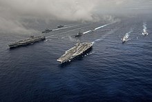 The aircraft carriers USS John C. Stennis (CVN 74) and USS Ronald Reagan (CVN 76) conducting dual aircraft carrier strike group operations and showing presence in the Indo-Asia-Pacific. 160618-N-OI810-085 (27916896695).jpg