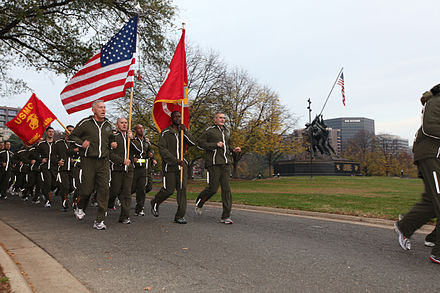 A Marine commandant leads a unit run wearing the PT tracksuit on the Marine Corps birthday