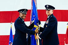General Michael A. Minihan, incoming AMC commander, receives the command guidon from General Charles Q. Brown Jr., Air Force chief of staff, during a change of command ceremony on October 5, 2021. AMC welcomes new commander during ceremony 211005-F-XS544-1080.jpg