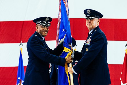 General Michael A. Minihan, incoming AMC commander, receives the command guidon from General Charles Q. Brown Jr., Air Force chief of staff, during a change of command ceremony on October 5, 2021.