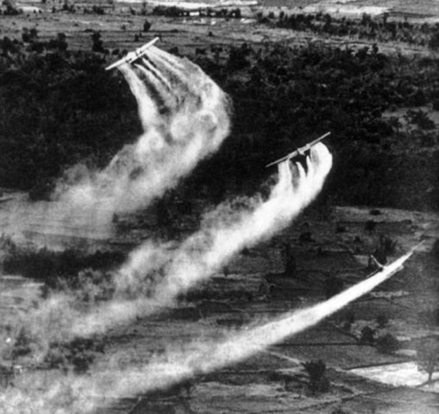 Three US Fairchild UC-123B aircraft spraying Agent Orange during the Operation Ranch Hand as part of a herbicidal warfare operation depriving the food