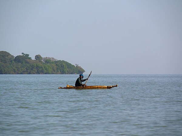 Amhara man riding a boat on the shores of Lake Tana.