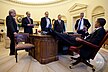 Barack Obama talks with aides around the Resolute desk, Feb. 4, 2009.jpg