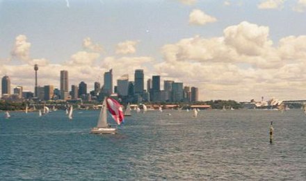 Yachts in Sydney Harbour; business district in background