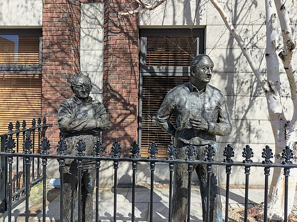 Statue of Friel (left) and John B. Keane in Dublin