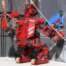 Tartan Rescue's CHIMP cuts wallboard at the 2013 DARPA Robotics Challenge Trials CHIMP cuts triangle at 2013 DRC Trials.png