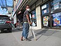 Clubfoot_beggar_with_cane_05