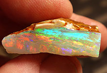 Multicolor rough crystal opal from Coober Pedy, South Australia, expressing nearly every color of the visible spectrum Coober Pedy Opal 2.jpg