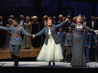 Final curtain call of the Metropolitan Opera's 24 December 2011 performance of La fille du regiment (l to r) Lawrence Brownlee (Tonio), Nino Machaidze (Marie), and Ann Murray (Marquise) Curtain Call (6766562451).jpg