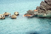 A burning oil rig off the coast of Wasina, 1999.