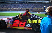 Irvan entering his car at Charlotte Motor Speedway in 1996. ErnieIrvanExitingCar.jpg