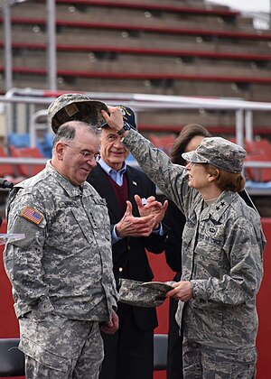 Major General Carol A. Timmons places the new cap on the newly promoted General Francis Vavala, April 1, 2017. Francis Vavala Promoted to 4-Star General.jpg