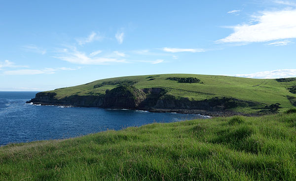 A coastal headland north of the town. The Kiama Coast Walk can be seen faintly along the hill.