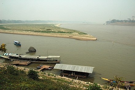 The confluence of the Mekong and the Ruak in the dry season: the foreground is Thailand, the sandbar is Myanmar and the opposite bank is Laos.