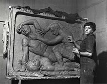 Helene Sardeau, American sculptor, 1899-1969, at work in her studio.jpg