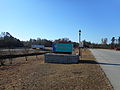 The welcome sign can be seen from both the main road and welcome center itself.