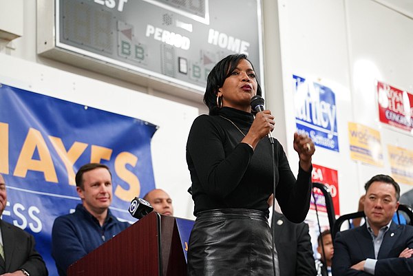 Hayes speaking at a 2018 campaign event with Senator Chris Murphy