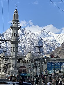 Mountains covered in snow, as seen from the Raja Bazar Road Gilgit