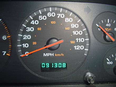 An electronic odometer (below speedometer) with digital display showing 91,308 miles (146,946 km)