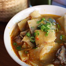 Kaeng yot maphrao sai kai is a northern Thai curry of palm shoots and chicken.