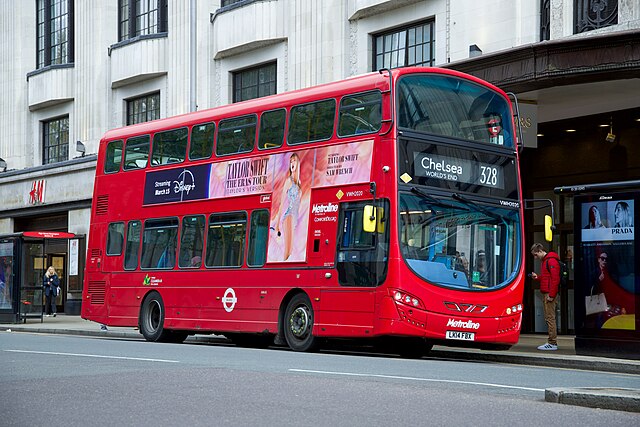 Wright Eclipse Gemini 3 bodied Volvo B5LH on route 328 at High Street Kensington station in April 2024