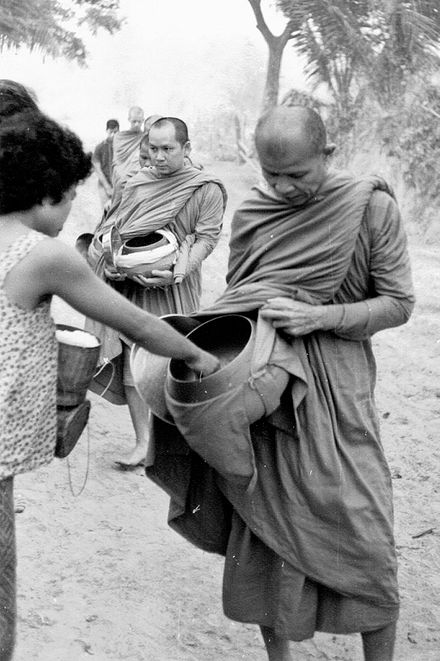 Ajahn Maha Bua led the monks (in this photo, he was followed by Phra Maha Amborn Ambaro, later the 20th Supreme Patriarch of Thailand) for morning alms around Ban Taad, Udon Thani, in 1965.