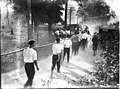 Miami University freshman-sophomore tug-of-war participants carrying rope 1914 (3191493060).jpg