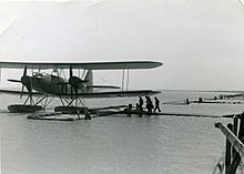 crew of the 6. Seenotstaffel is walking from the Zeeburgereiland over the jetty to their Heinkel He 59. Probably in the second half of 1940 or 1941. Nadat-de-britse-overheid-medio-juli-1940-had-afgekondigd-dat-de-wit-gespoten-he-59-s-evengoed-zouden-worden-neergeschoten.jpg