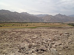 A panorama similar to the site of Pernil Alto: a low terrace rising above an irrigated valley with a river in the distance. Palpa Province, Peru - panoramio (2).jpg