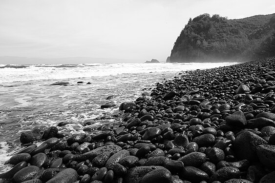 Volcanic rock pebbles on a seashore