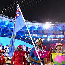 Etimoni Timuani during the Parade of Nations in the 2016 Rio Summer Olympics. Porta-bandeira de -Tuvalu na abertura da -rio2016 (28882641955) 2.jpg